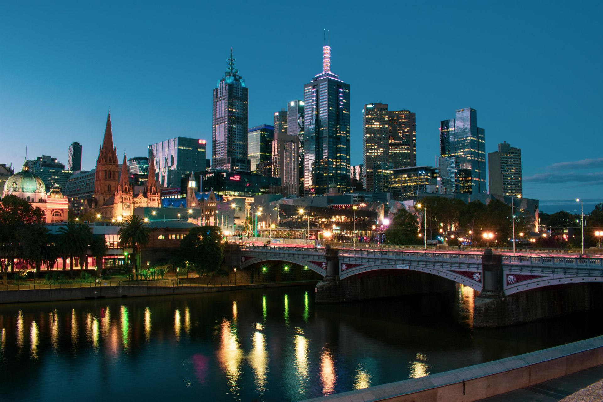 Melbourne city skyline at dusk across the Yarra River
